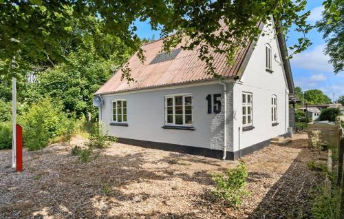 a small white house with a red roof at 3 Bedroom Lovely Home In Ulfborg in Ulfborg