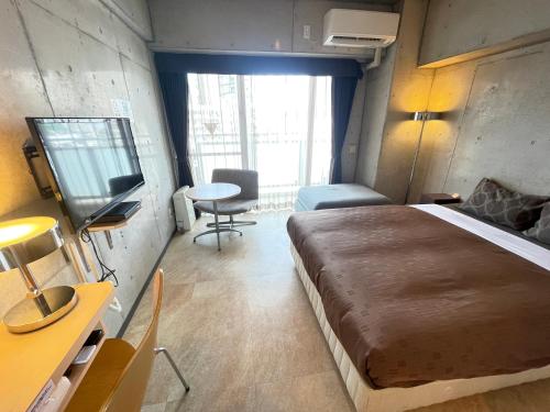 Ένα ή περισσότερα κρεβάτια σε δωμάτιο στο Condominio Makishi