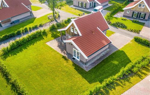 an overhead view of a house with a red roof at Buitengoed Het Lageveld - 93 in Hoge-Hexel