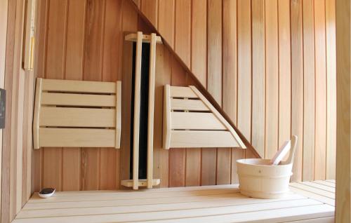 a sauna with a toilet and a wooden wall at Buitengoed Het Lageveld - 93 in Hoge-Hexel