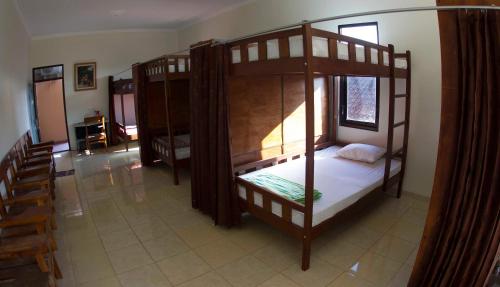 an overhead view of a bedroom with two bunk beds at Crown Guest House in Ambarawa