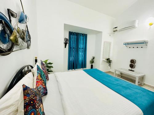 Ένα ή περισσότερα κρεβάτια σε δωμάτιο στο Serene Beautiful 4bhk Arpora baga Pool