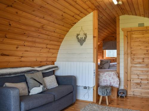 a living room with a couch and a bedroom at Jacob's Den - Uk40976 in Felindre