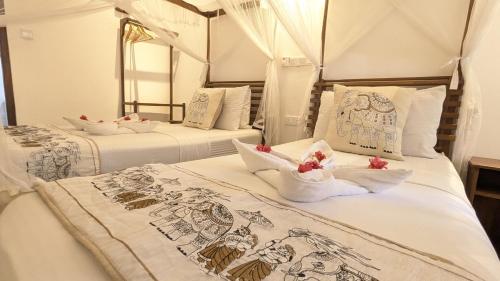 Cama o camas de una habitación en Suriya Arana
