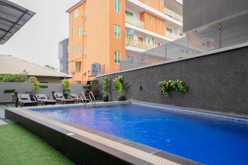 a swimming pool on the side of a building at 2 Bedroom Admiralty, Phase 1 in Lekki Phase 1