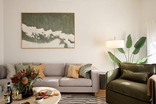 a living room with a couch and a table at The Brass Bear in Darlinghurst in Sydney