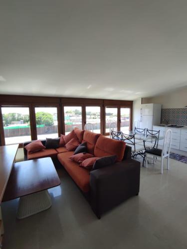 a large living room with a couch and a table at La Buena Vida, el Palmar in El Palmar