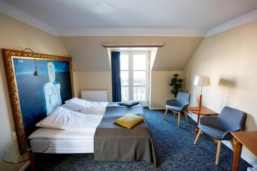 Postel nebo postele na pokoji v ubytování Hotel Ringkøbing