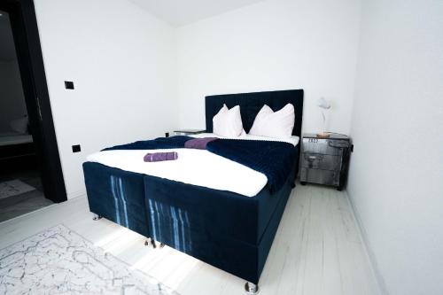 Postel nebo postele na pokoji v ubytování Apartmani M&DŽ Bihać