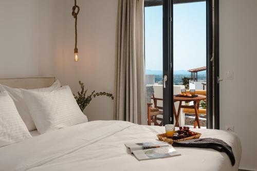 Ένα ή περισσότερα κρεβάτια σε δωμάτιο στο Naxos Balcony Apartments