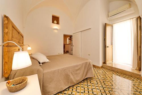 Кровать или кровати в номере Elegante Casa a Parabita con Wifi vicino Gallipoli ed il mare