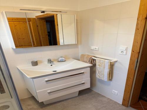 a bathroom with a sink and a mirror at holiday home, Axams in Innsbruck