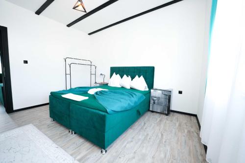 Postel nebo postele na pokoji v ubytování Apartmani M&DŽ Bihać