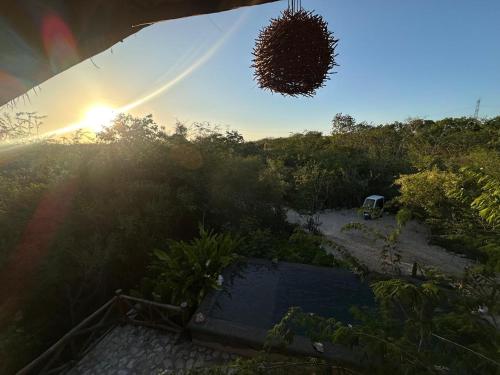 a view of the sunset from the roof of a house at Hotel Aldea Maya in Valladolid