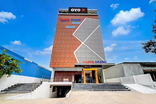 a building with a viking channel sign on it at Hotel O Vijaya Grand in Pedda Ambarpet