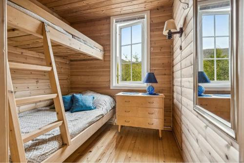 Ένα ή περισσότερα κρεβάτια σε δωμάτιο στο Cabin By The Beach In Stonglandsodden