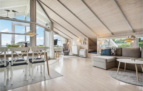 a living room with a couch and a table at Cassiopeia in Sjølund