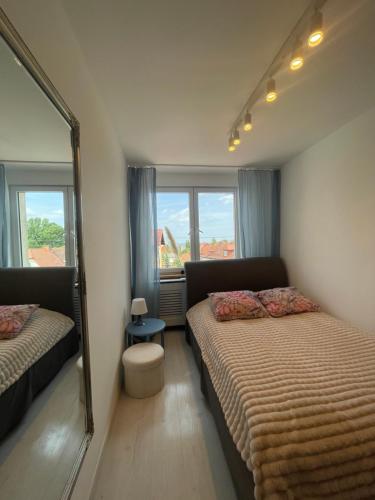 Postel nebo postele na pokoji v ubytování Apartament Słowackiego Sopot