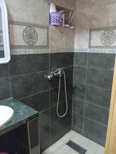 a bathroom with a shower and a sink at Alliance darna in Fnidek