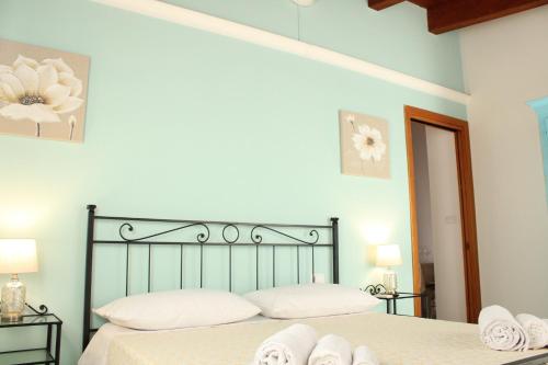 Postel nebo postele na pokoji v ubytování Le Rocce Antiche Hotel Resort