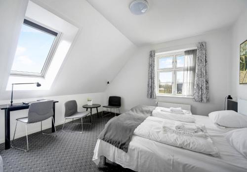 Postel nebo postele na pokoji v ubytování Hotel Søparken