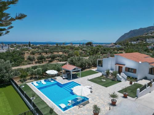 an aerial view of a villa with a swimming pool at Villa Aelia Kefalos-Private & Spacious with Pool in Kámpos