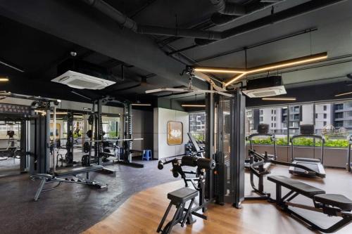 a gym with several treadmills and cardio machines at Nhà của Hải - Apartment Luxury Diamond Brilliant in Ho Chi Minh City