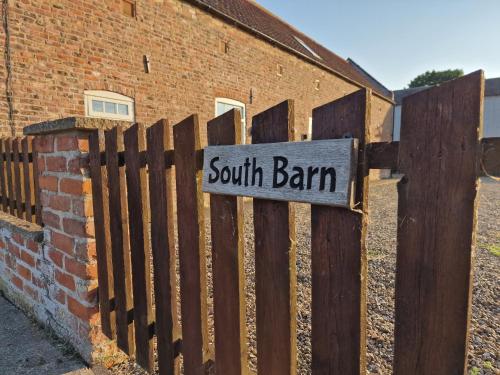 a sign that reads south bank on a fence at Southbarn - Spectacular Country Home in Winestead
