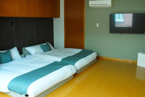 Postel nebo postele na pokoji v ubytování Kototoki-Ren-401 Deluxe Family Suite room
