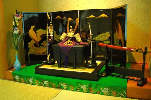 a figurine of a man sitting on a table at Kototoki-Ren-401 Deluxe Family Suite room in Hiroshima