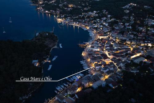 an aerial view of a small harbor at night at Casa Mare e Olio by All About Paxos in Gaios