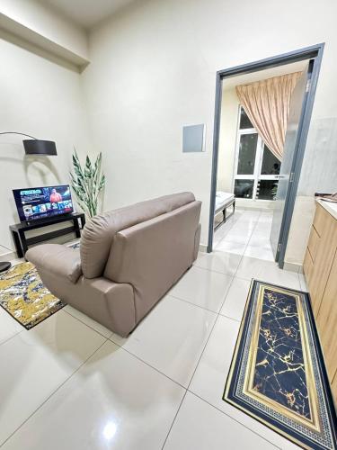 a living room with a couch and a table at CHEAPEST PROMO Private Modern King Suites above Mesamall Nilai, 3 Km to USIM in Nilai