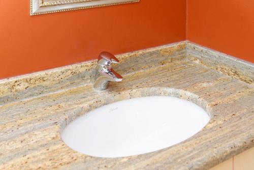 a bathroom sink with a faucet on a counter at Ortnerhof - Ihr Zuhause am Fuße der Alpen in Ruhpolding