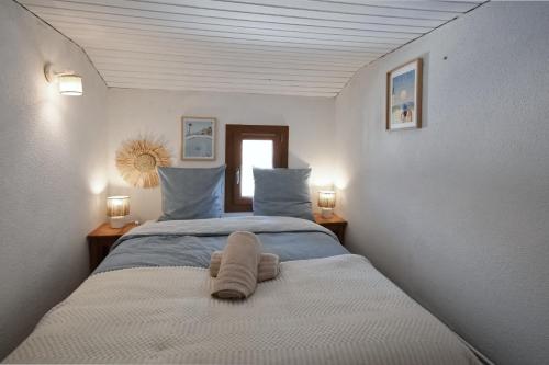 Ένα ή περισσότερα κρεβάτια σε δωμάτιο στο La Mouvette - 10min de le Plage