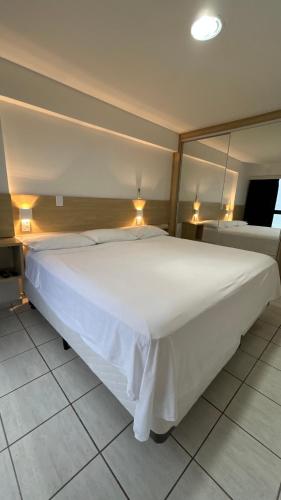 Postel nebo postele na pokoji v ubytování Ap Ponta Negra