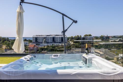 a bath tub with a view of a city at Penthouse Alure in Split
