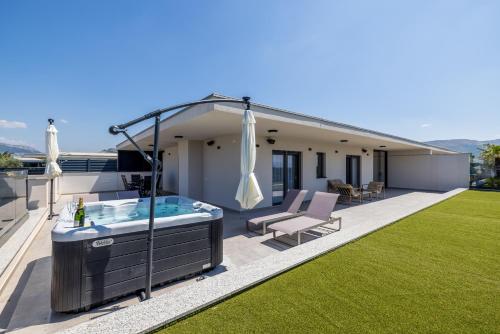 a hot tub on the roof of a house at Penthouse Alure in Split
