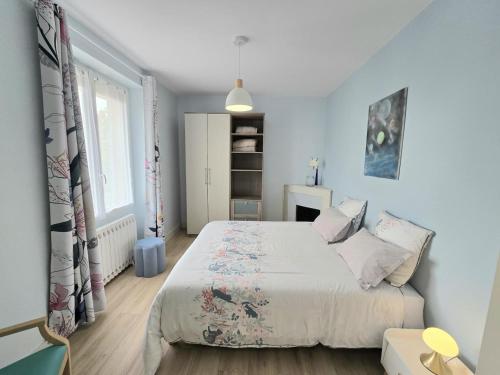 a bedroom with a large bed and a window at Chez louise in Rouffignac Saint-Cernin