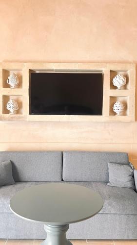 a living room with a couch and a table at Borgo Don Ciccio in Felline
