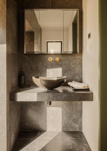 a bathroom with a sink and a mirror at Aritis 3 in Corfu