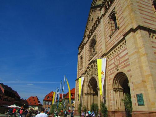 a large building with flags in front of it at Alte Heimat in Schwegenheim
