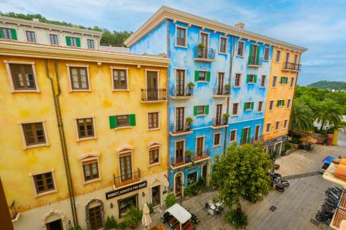 an overhead view of a building with colorful paint at Jana Hotel & Apartment - Firework & Aquatopia Water Park in Phu Quoc