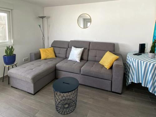 a living room with a couch and a table at West Country House in Lourinhã