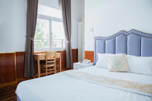 Ένα ή περισσότερα κρεβάτια σε δωμάτιο στο Bighotel Can Tho