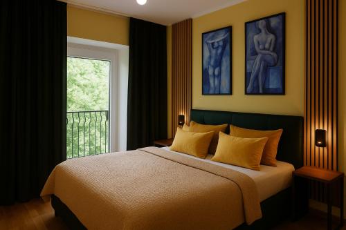 a bedroom with a large bed and a window at Park Villa Apartments in Bad Kissingen