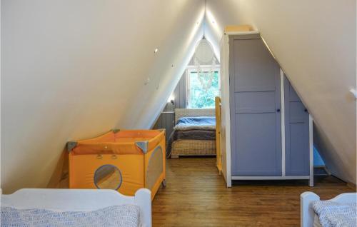 a attic room with a staircase and a room with a closet at Lovely Home In Kerschenbach With Wifi in Kerschenbach