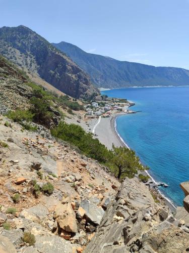 a view of a beach on a rocky shore at Hotel Agia Roumeli by the SEA in Agia Roumeli