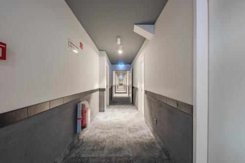 a hallway of a building with a hallway at a&o Hamburg City in Hamburg
