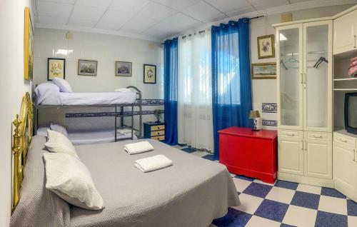 a bedroom with two bunk beds and a tv at 6 Bedroom Amazing Home In Lucena in Lucena