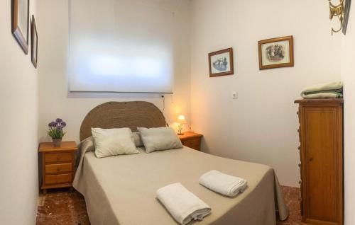 a bedroom with a bed with two pillows on it at 6 Bedroom Amazing Home In Lucena in Lucena